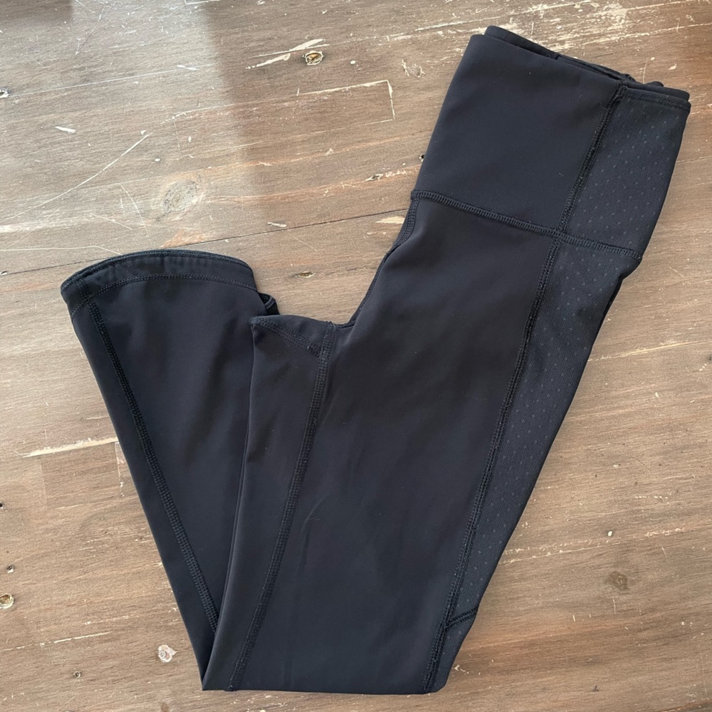 Lululemon black leggings with mesh accent. Size 4. Great condition